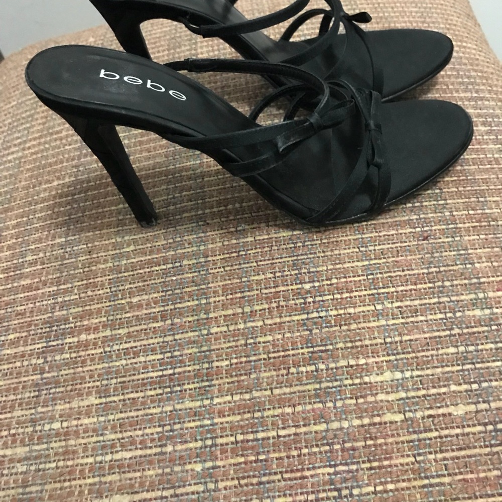 Black Bebe slip on sandals.